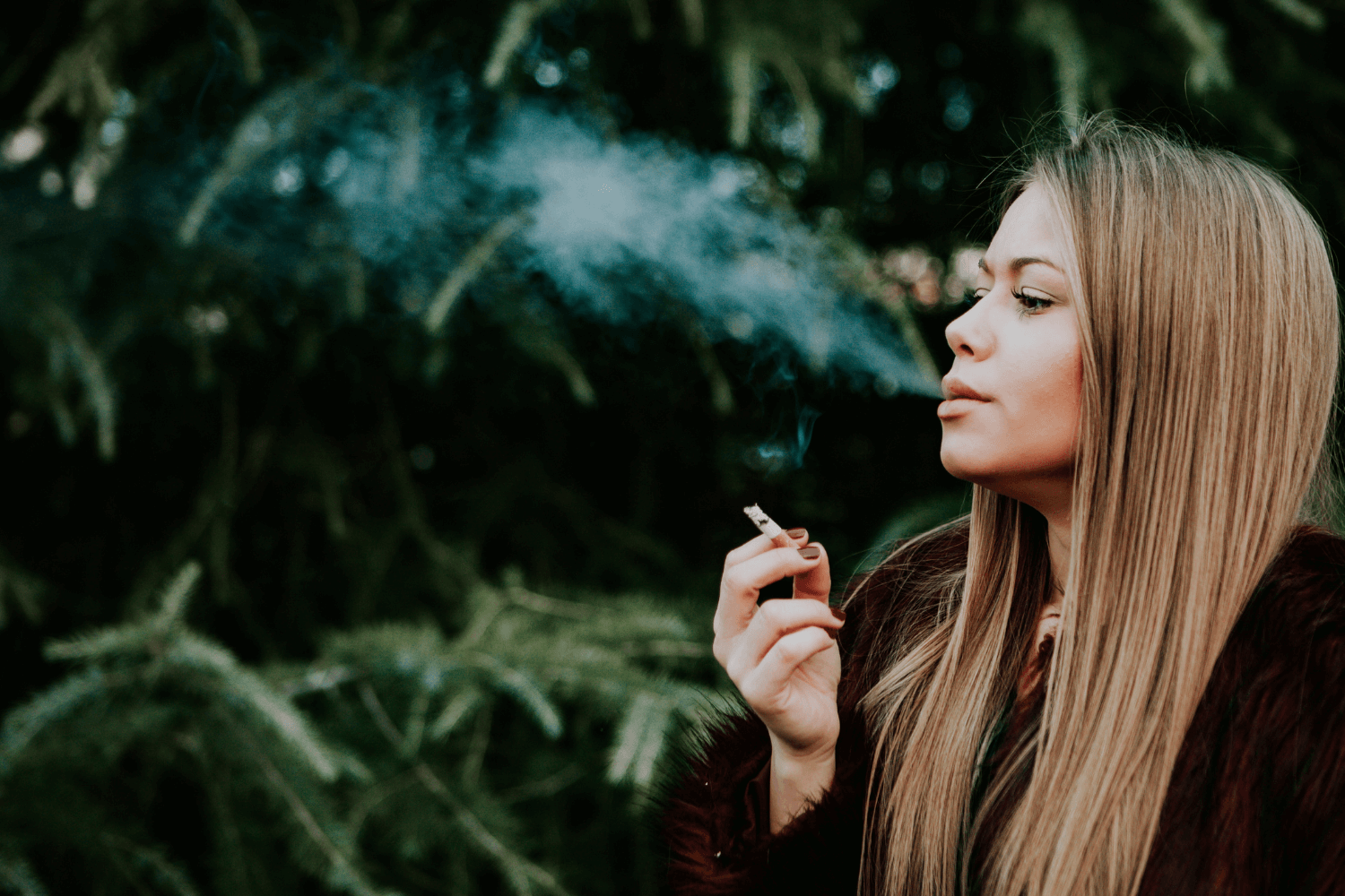 Woman Considering Smoking And Oral Health