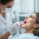 Tongue Discoloration: Understanding What Different Colors Mean For Your Health 38 A Healthcare Professional Is Examining A Patients Tongue Using A Tongue Scraper And Proper Lighting Assessing Its Color And Surface For Signs Of Conditions Such As Oral Thrush Or A Black Hairy T 1