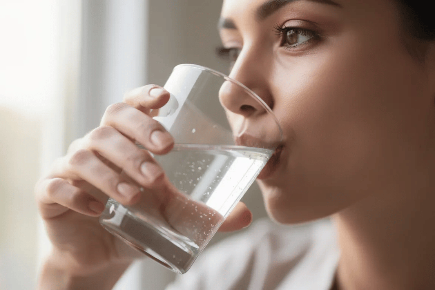 A Close-Up Image Shows A Person Drinking A Glass Of Water, Emphasizing The Importance Of Hydration For Maintaining Good Oral Health, Especially For People With Diabetes. Staying Hydrated Can Help Prevent Gum Disease And Support Overall Health By Aiding In Blood Sugar Control.