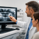 Dentist Reviewing Digital X-Rays With A Patient In A Modern Dental Office To Diagnose Pain Cause