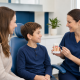 Dental Sealants For Kids: Questions Parents Can Ask At A Preventive Visit 2 Parent And Child Speaking With A Dentist About Preventive Dental Care